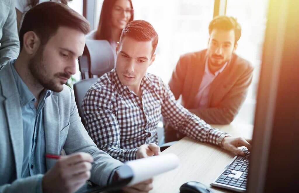 Group of coworkers looking at a paper